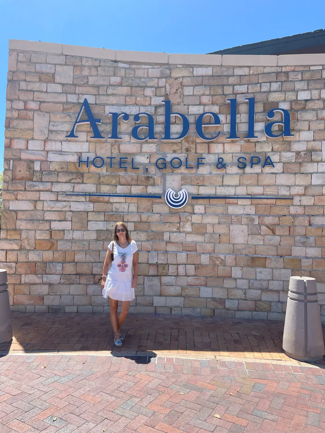 A lady standing at Arabella hotel golf and Spa